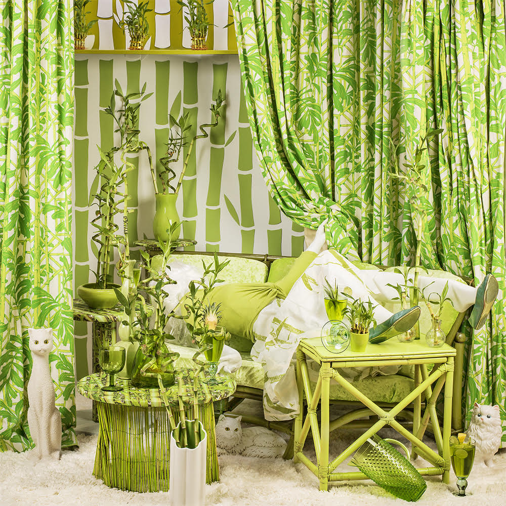 mannequin figure disappears into bright green bamboo-themed furnishings